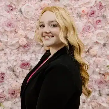 Portrait of Mia, a professional stylist at Salon Bloom - Fort Myers, FL, showcasing their expertise and style.
