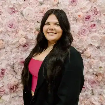 Portrait of Adi, a professional stylist at Salon Bloom - Fort Myers, FL, showcasing their expertise and style.