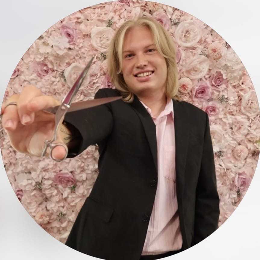 Portrait of Dylan, a professional stylist at Salon Bloom - Fort Myers, FL, showcasing their expertise and style.